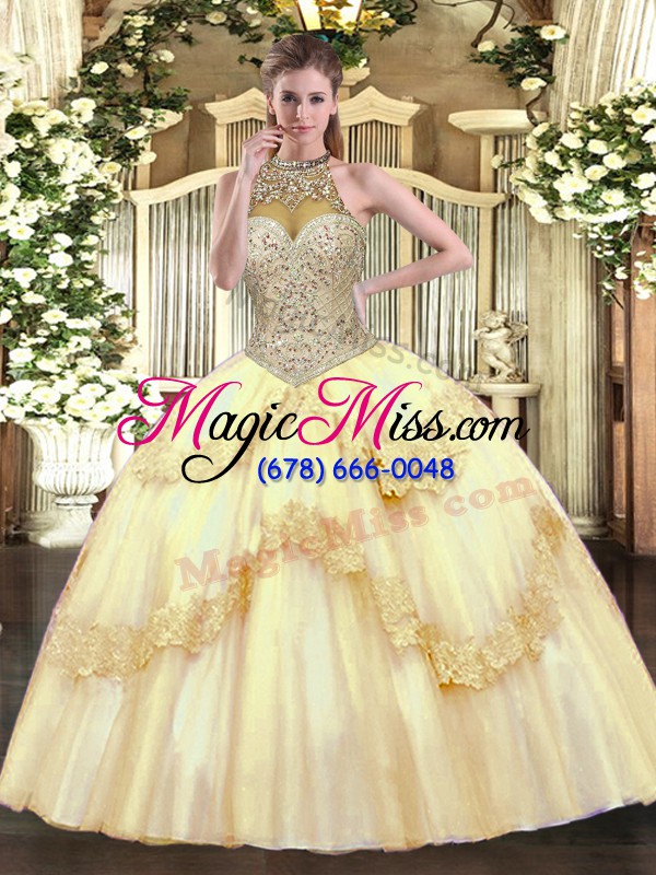 wholesale pretty sleeveless tulle floor length lace up quinceanera gowns in gold with beading and appliques