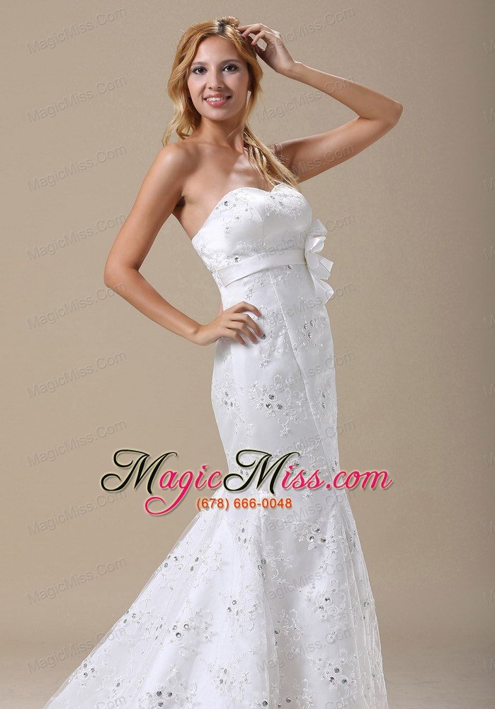 wholesale mermaid wedding dress in denver colorado with sash and lace over skirt
