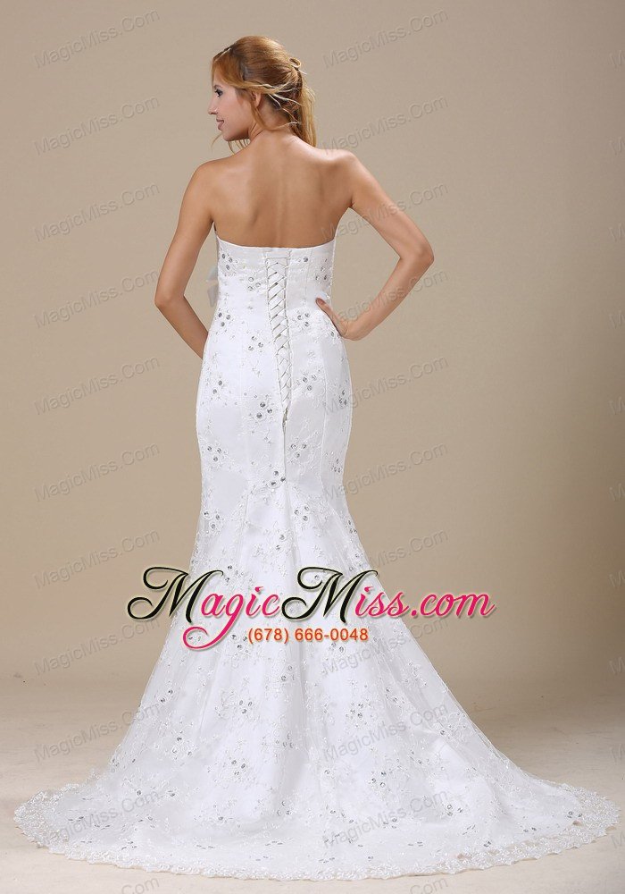 wholesale mermaid wedding dress in denver colorado with sash and lace over skirt