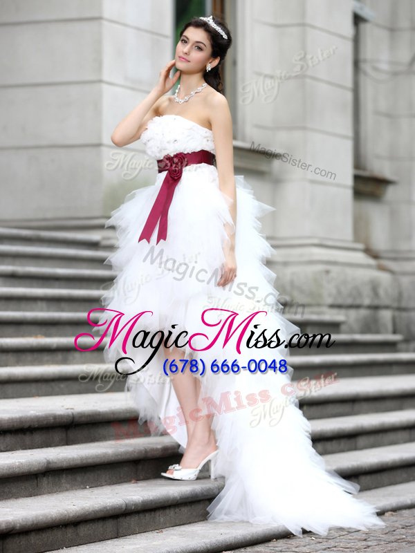 wholesale glittering white organza zipper wedding dress sleeveless high low ruffles and belt and hand made flower